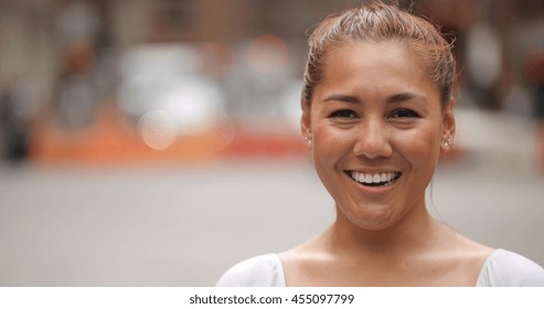 Young Latina Woman In City Face Portrait Smile