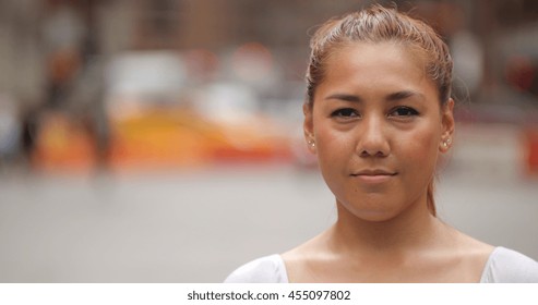 Young latina woman in city face portrait