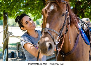 Young Latina Woman Smiling Next To Her Silla Argentina Horse