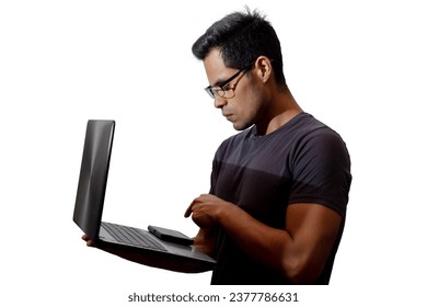 Young Latino with glasses and laptop, about to press a key, netw
