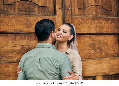 Young Latino Male And Female Couple Looking At Each Other In Love Between 25 And 35 Years Of Age