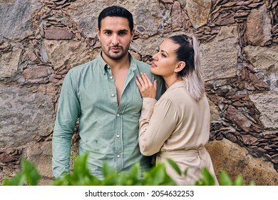 Young Latino Male And Female Couple Looking At Each Other In Love Between 25 And 35 Years Of Age