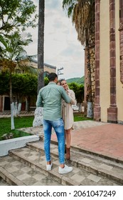 Young Latino Male And Female Couple Looking At Each Other In Love Between 25 And 35 Years Old