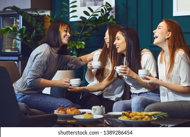 Young Laughing Women Having Tea Party 