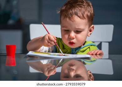 Young learner expressing ideas through colors and brush strokes.