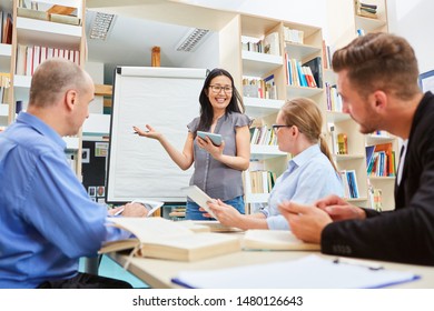 Young Lecturer In A Workshop For Further Education During The Presentation On The Whiteboard