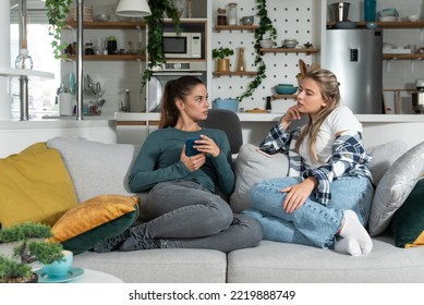 Young Lesbian Couple At Home Have A Problem And Argue Due To Jealousy Caused By Chatting And Flirting Via Social Media Networks On Smart Phones, Relationship Difficulties Problems And Distrust.