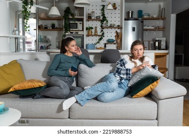 Young Lesbian Couple At Home Have A Problem And Argue Due To Jealousy Caused By Chatting And Flirting Via Social Media Networks On Smart Phones, Relationship Difficulties Problems And Distrust.