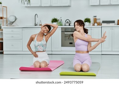 A young lesbian couple practices yoga together in their modern apartment. - Powered by Shutterstock