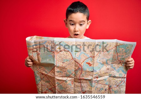 Similar – Image, Stock Photo boy with hat and map on blue background