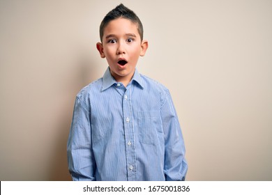 Young Little Boy Kid Wearing Elegant Shirt Standing Over Isolated Background Afraid And Shocked With Surprise Expression, Fear And Excited Face.