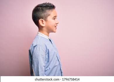 Young Little Boy Kid Wearing Elegant Shirt Standing Over Pink Isolated Background Looking To Side, Relax Profile Pose With Natural Face With Confident Smile.