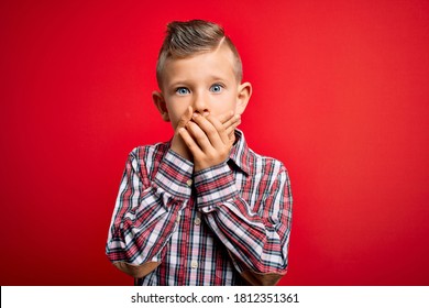 Young Little Caucasian Kid With Blue Eyes Standing Wearing Elegant Shirt Over Red Background Shocked Covering Mouth With Hands For Mistake. Secret Concept.