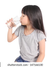 Young Little Girl Drinking Water. 