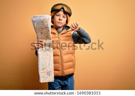 Similar – Image, Stock Photo boy with hat and map on blue background