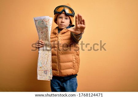 Similar – Image, Stock Photo boy with hat and map on blue background