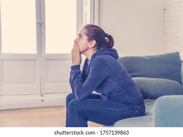 Young lonely attractive latin woman crying on couch feeling sad tired and worried suffering depression isolated at home. Mental Health and lockdown, stress, unemployment and heartbroken concept. - Shutterstock ID 1757139863