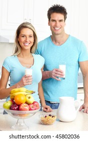 Young Love Couple  Drinking Milk At Kitchen