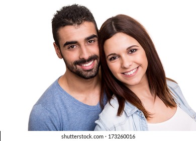 Young love couple hugging over white background