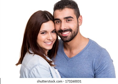 Young love couple hugging over white background