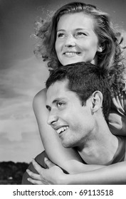 Young love Couple smiling under sky