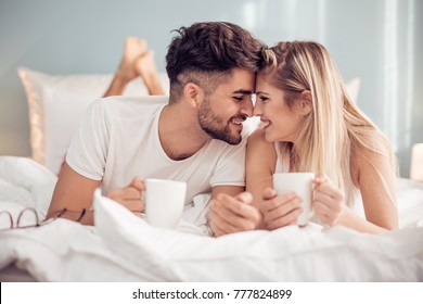 Young Loving Couple In The Bed.Modern Lifestyle Concept.