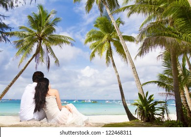 Young Loving Couple On Tropical Sea Background - Wedding On Beach