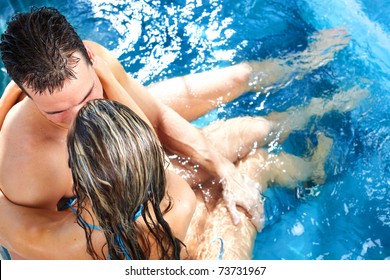 Young loving couple relaxing in a comfortable  jacuzzi.