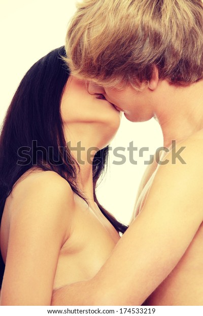 Young Nudist Kissing