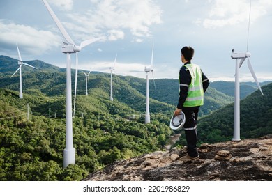 Young maintenance engineer man working in wind turbine on the mountain,Power generation Saving and using renewable energy concept. - Shutterstock ID 2201986829