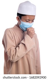 A Young Malay Boy Wearing A Malay Costume And Head Mask Isolated On White Background