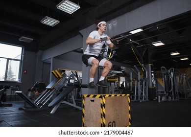 Young Male Athlete Jumping On A Box At Functional Training Gym