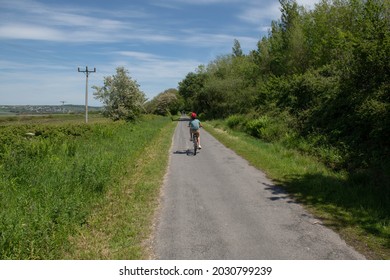 Young Male Boy Cycling Along The Tarka Trail On The South West Coast Path At Fremington Quay Between Barnstaple And Instow On The North Devon Coast, England, UK