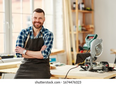 Young Male Carpenter    Working In A Workshop
