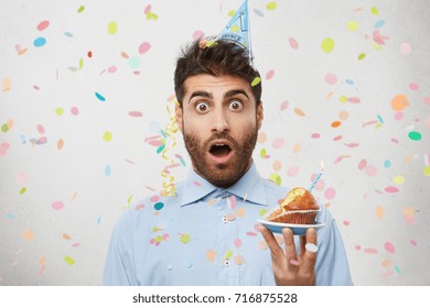 Young Male Celebrates Entering To University, Invites Many Friends For This Special Occasion, Has Shocked Expression. Birthday Man With Cupcake Being Surprised To See Former Girlfriend On Party