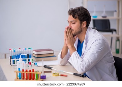 Young Male Chemist Working At The Lab