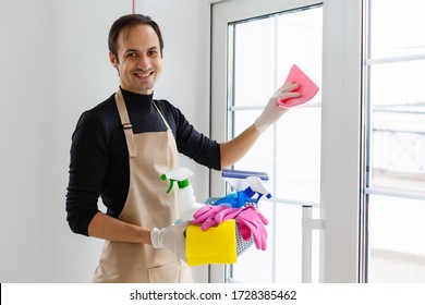 Young Male Cleaner With Cleaning Equipment