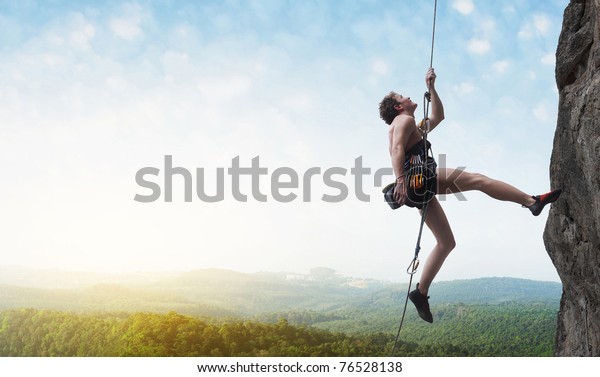 Young Male Climber Hanging By Cliff Stock Photo (Edit Now) 76528138