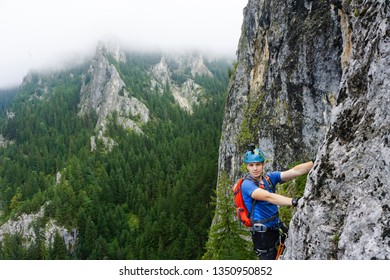 Young Male Climber On Via Ferrata Astragalus, Romania, Europe, In Summer