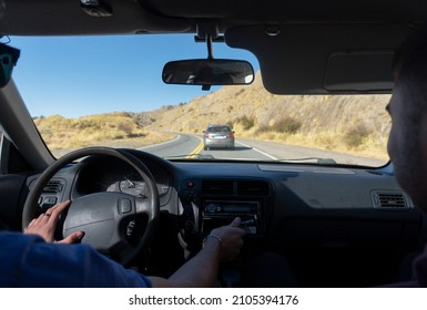 Young Male Couple Driving A Car On A Trip Travel Holiday