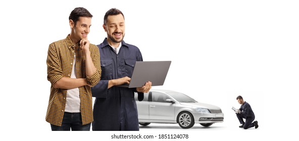 Young Male Customer And An Auto Mechanic Looking At A Laptop Computer In A Car Repair Shop Isolated On White Background