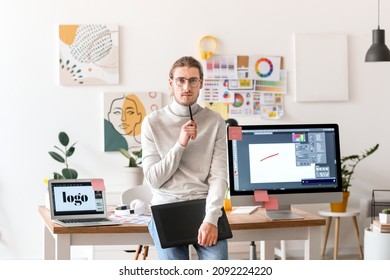 Young male designer working in office - Powered by Shutterstock