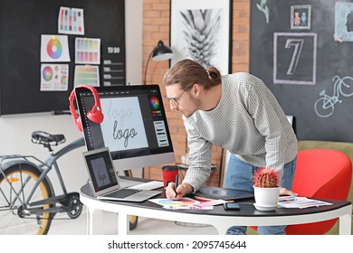 Young male designer working in office - Powered by Shutterstock