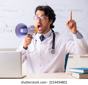 Young Male Doctor Neurologist In Front Of Whiteboard