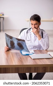 Young Male Doctor Radiologist Sitting In The Clinic