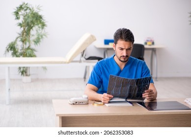 Young Male Doctor Radiologist Sitting In The Clinic