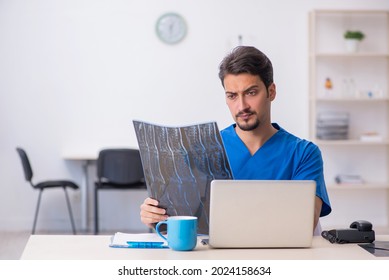 Young Male Doctor Radiologist Working In The Clinic