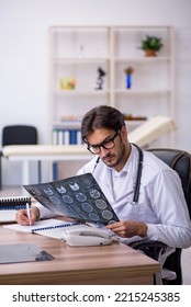 Young Male Doctor Radiologist Working In The Clinic