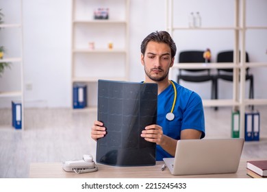 Young Male Doctor Radiologist Working In The Clinic