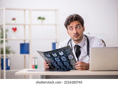 Young Male Doctor Radiologist Working In The Clinic